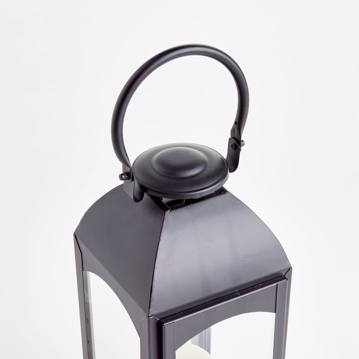 The Antoinne Outdoor Black Lantern Large is made with faux zinc material, bringing the classic charm of Europe. Its dark black hue adds a touch of drama to any outdoor space. With its expertly crafted faux zinc material and striking black color, the Antoinne Outdoor Black Lantern Large exudes a timeless European aesthetic and creates a sophisticated ambience for any outdoor setting.