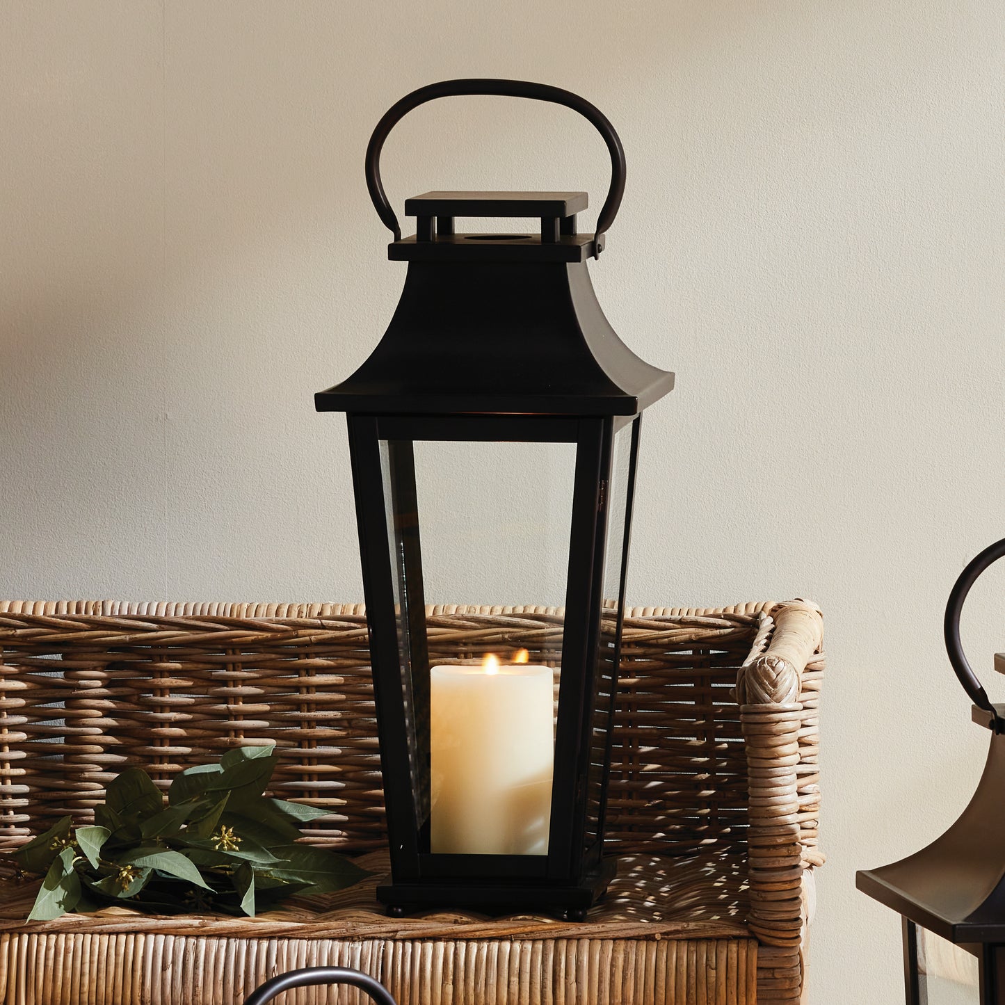 Scaled to wow, this outdoor lantern is fitted with round, flattened moveable handles. Powder-coated & ready for the outdoors, it makes a statement in any environment.