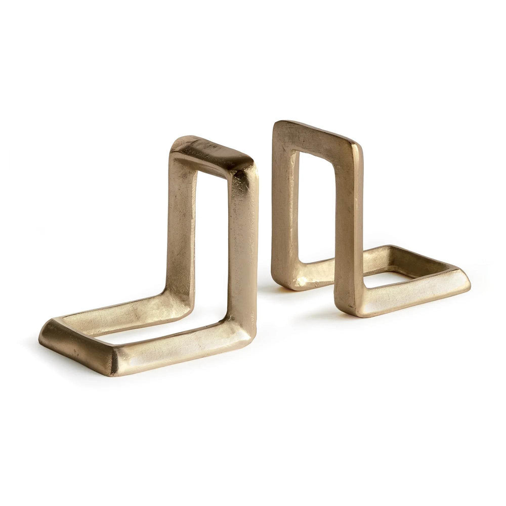 Two gold bookends on a white background