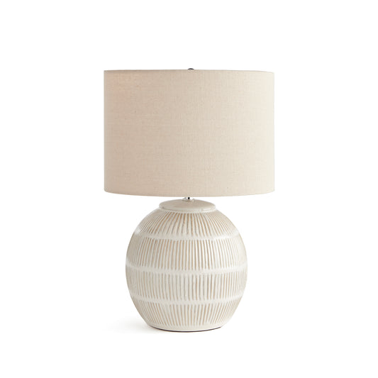 With a rounded ceramic body and a hatch mark pattern, this lamp adds a bit of character to any setting. Topped off with a natural linen shade, it makes a lovely accent for bedside table, side table or desk.