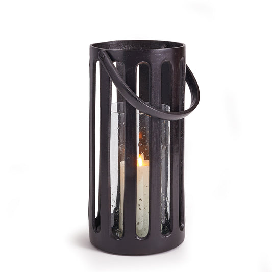 This cast aluminum hurricane has a great presence. Strong and sturdy, it makes a solid accent. The seeded glass insert, it diffuses the candlelight and brightens up your space.