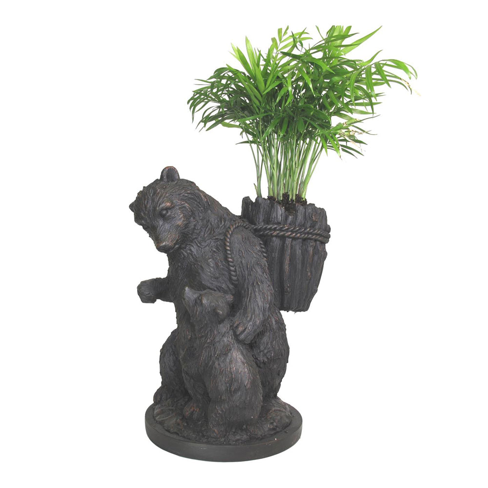 The Bear with Cub Garden Planter is a charming and rustic addition to any home or garden. Hand-painted with a dark walnut finish, this unique sculpture features a detailed bear and cub, perfect for a Black Forest or lodge-style look. It can be used in yards, lawns, living rooms, and more, making it a versatile choice for any space. Each resin planter is expertly crafted and finished in a multi-step process for a beautiful and durable result.