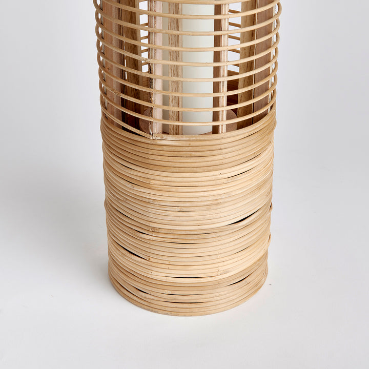 Crafted with expertise and sustainable bamboo, this lantern's tall and slender rattan body exudes natural elegance and makes a statement in any space. Whether in a coastal setting or as a stylish accent, its unique design adds a touch of nature to any room.