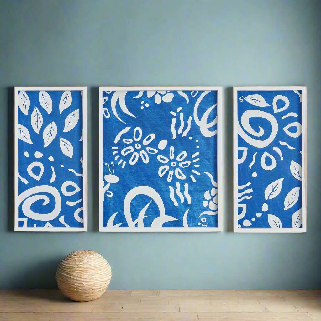 Experience the charming and lively cut-out designs of Susan Nastasic's original artwork with these Whimsical Coastal Wall Prints. Captivatingly showcased in simple white frames, these prints bring a refreshing splash of blue to any space. Perfect for a coastal aesthetic or to add a touch of playfulness to your decor.