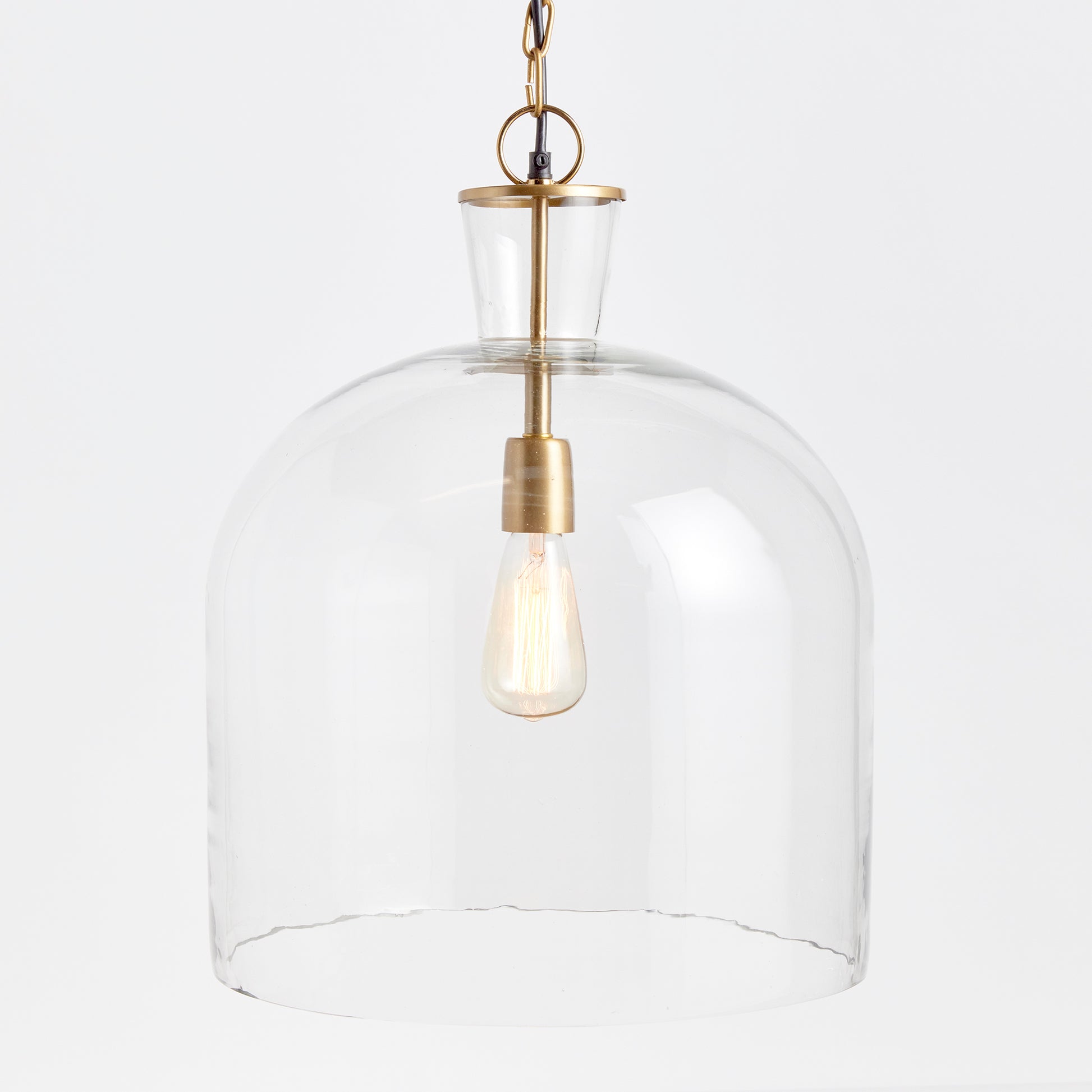 A classic mix of warm brass and seeded glass in grand scale, this pendant is a traditional fixture. Over an island, in an entry or foyer, a beautiful fixture. Expertly designed and crafted, the Belle Glass Grande Island Pendant Light is the perfect addition to any home