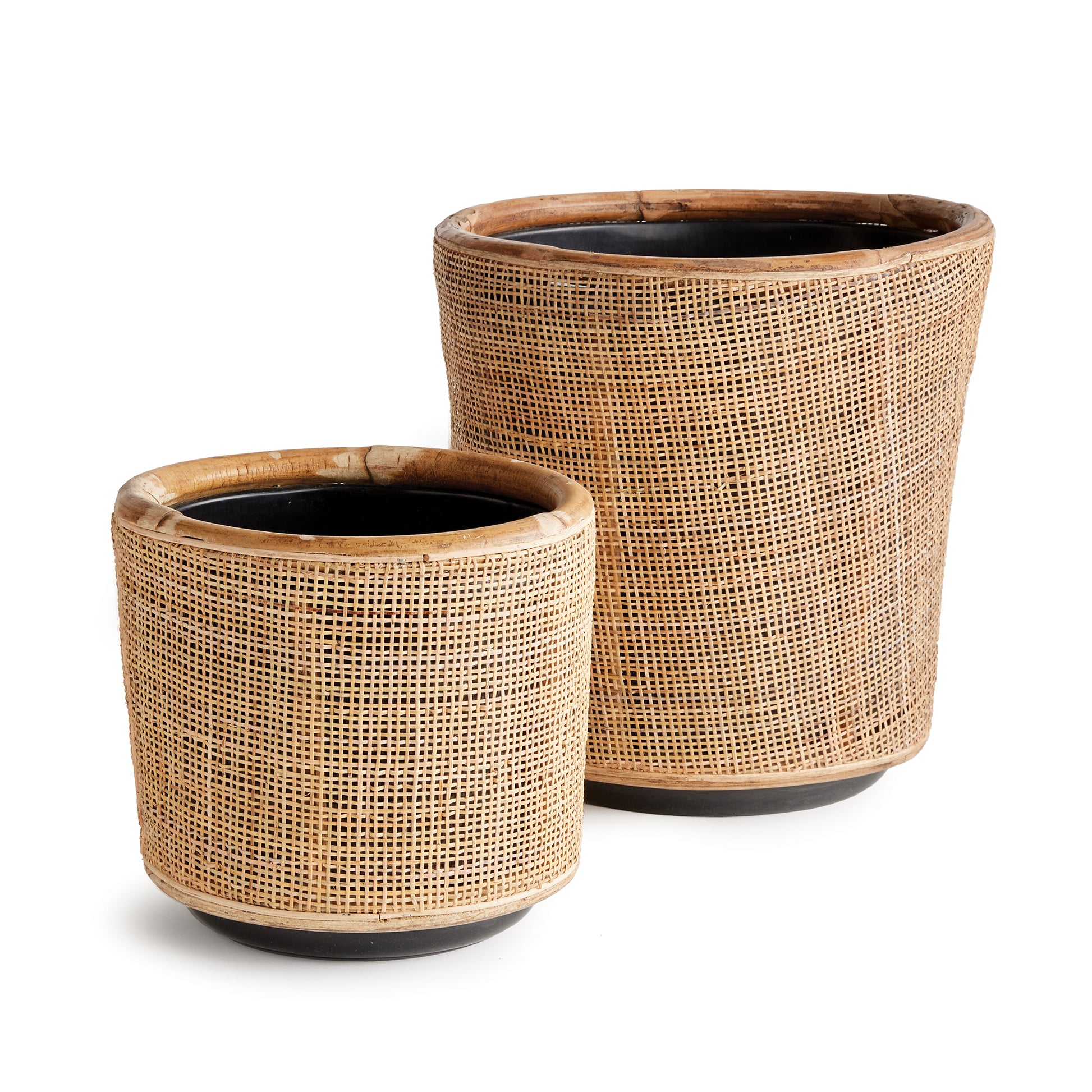 Here's a smart idea- a modern rattan planter tightly woven around a grower's pot. The plastic pot helps the weave retain shape while elevating the rattan off the ground. Simply Brilliant.