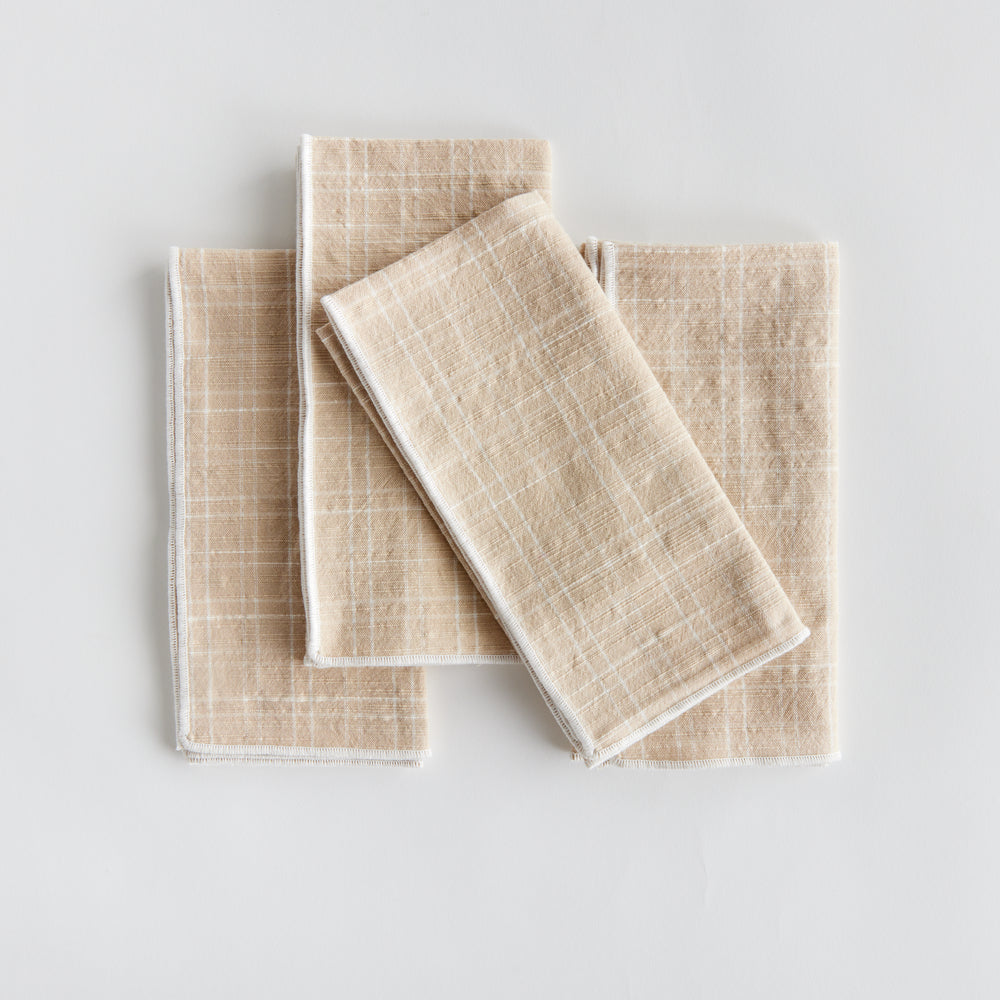 Bring a touch of softness to the table with this set of four cotton napkins. Beautiful in tone and texture, the soft taupe is made to coordinate with any tablescape. Elevate your dining experience with these high-quality cotton napkins. Their luxurious texture and neutral taupe color will elevate any tablescape, making it perfect for any occasion.