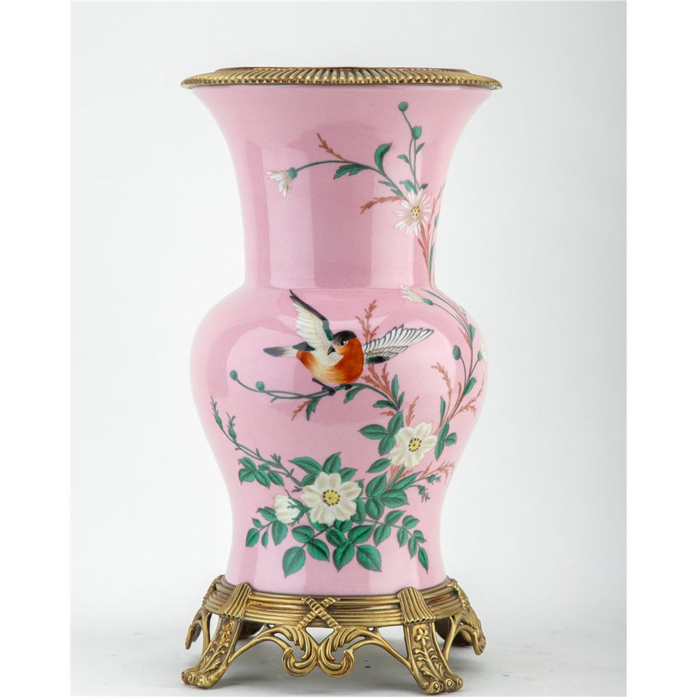 Introducing the Khom Pink Floral Pattern Vase, adorned with delicate flowers and birds. Made of high-quality porcelain with bronze accents, this decorative vase adds elegance to any living room or garden collection. Expertly crafted for a timeless and beautiful addition to your home.