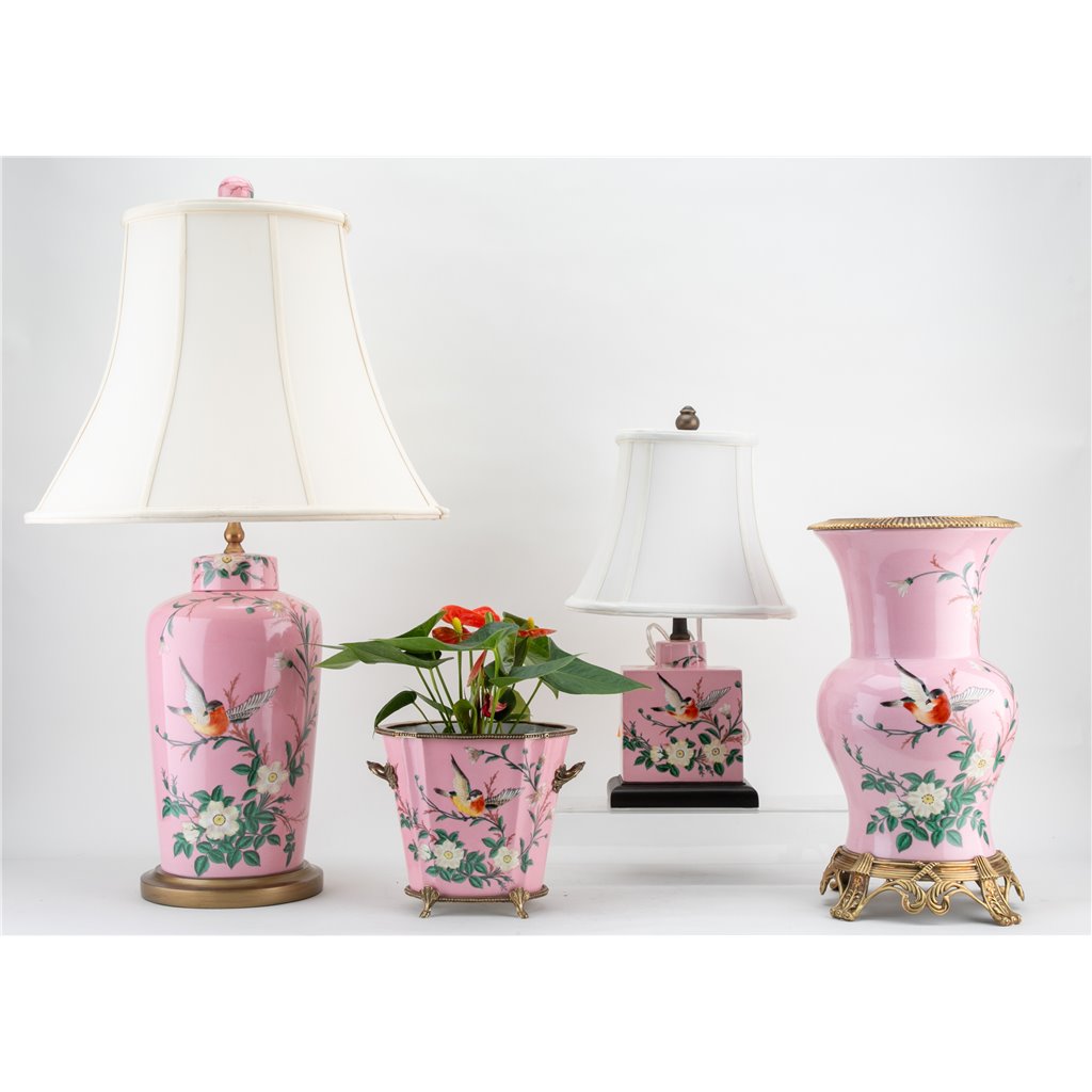 Introducing the Khom Pink Floral Pattern Vase, adorned with delicate flowers and birds. Made of high-quality porcelain with bronze accents, this decorative vase adds elegance to any living room or garden collection. Expertly crafted for a timeless and beautiful addition to your home.