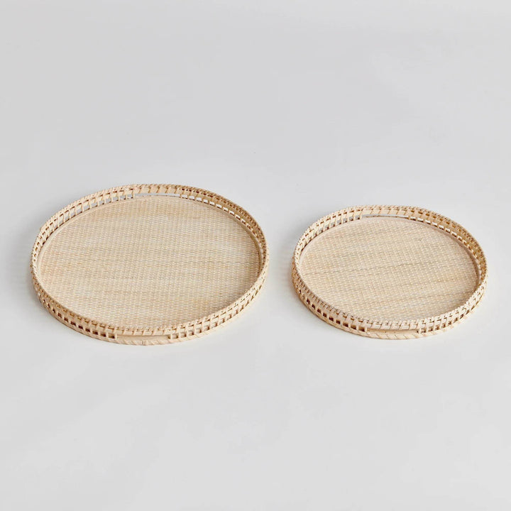 Crafted from woven rattan and coated with a fresh whitewash finish, these coastal-inspired trays add a touch of charm to any space. Use them on your coffee table or ottoman as a stylish base for creating beautiful vignettes. Enhance your home decor with Barri Coastal Decorative Trays Set of 2.