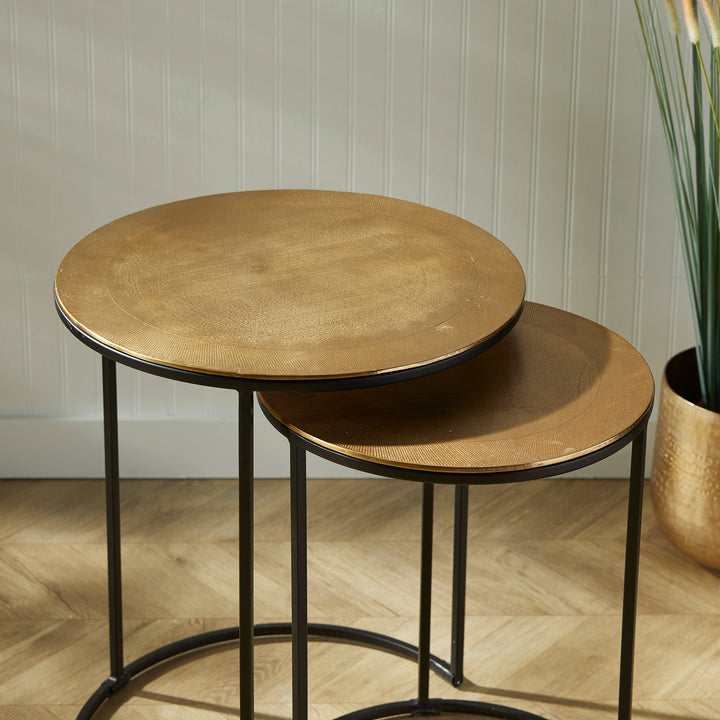 Expertly designed with durable cast aluminum construction and intricate patterns, the Alamar Gold &amp; Bronze Side Tables make a stunning addition to any living space. Featuring an elegant outer band of rich bronze, these nesting tables are perfect for placement near a sofa or in a small foyer for both aesthetic and functional purposes.