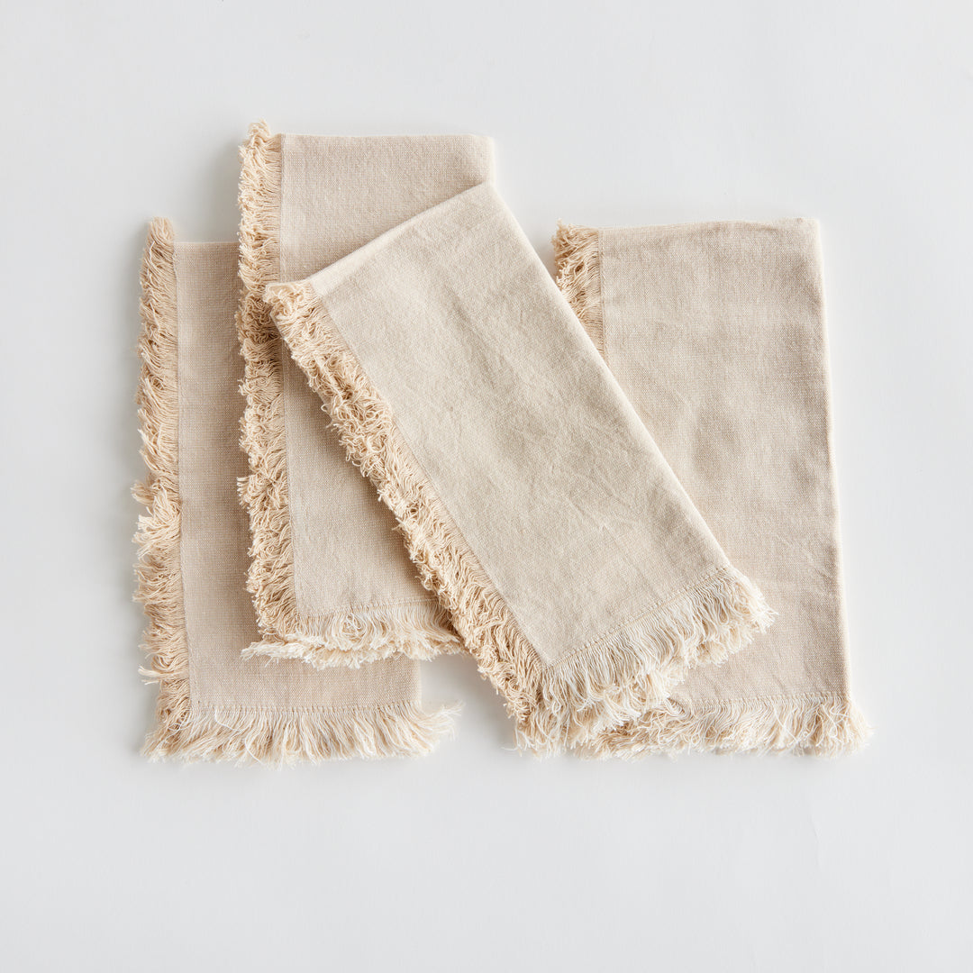 Elevate your dining experience with the Aura Cotton Napkins, Set Of 4. Made from high-quality cotton, these napkins offer a luxurious feel and timeless beauty to any tablescape. The soft taupe color complements any decor, making it a versatile addition to your tableware collection. Each set includes four napkins, perfect for creating a coordinated tablescape for any occasion. Add a touch of elegance to your table with these beautifully toned and textured napkins.