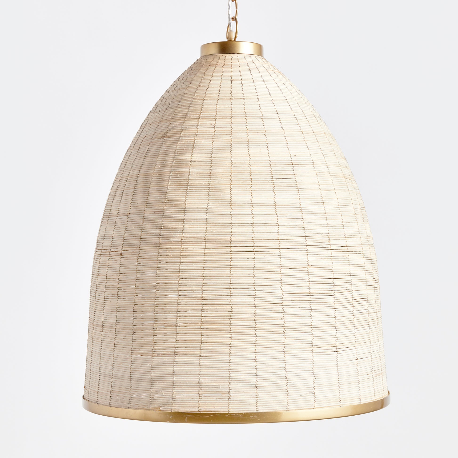 Woven in a natural cane rattan, with subtle variations in color making each one truly unique, this pendant is an instant classic. The brass details on the top and along the bottom rim make it decidedly more refined. And talk about scale! A show-stopping choice for kitchen island, entry foyer or hallway.