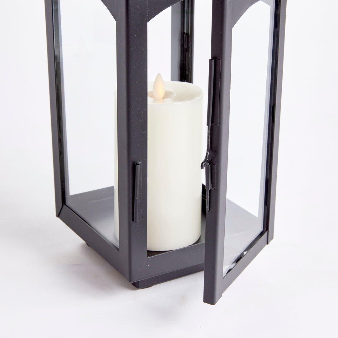 Experience the expert craftsmanship of the Antoinne Outdoor Black Lantern Small, exuding timeless elegance with a nod to classic European design. This chic lantern boasts a sophisticated aesthetic, complemented by a bold black tone that adds a touch of drama to any outdoor space. Crafted with high-quality faux zinc material, this lantern is built to last and elevate the style of your outdoor area with its professional and expertly crafted design.