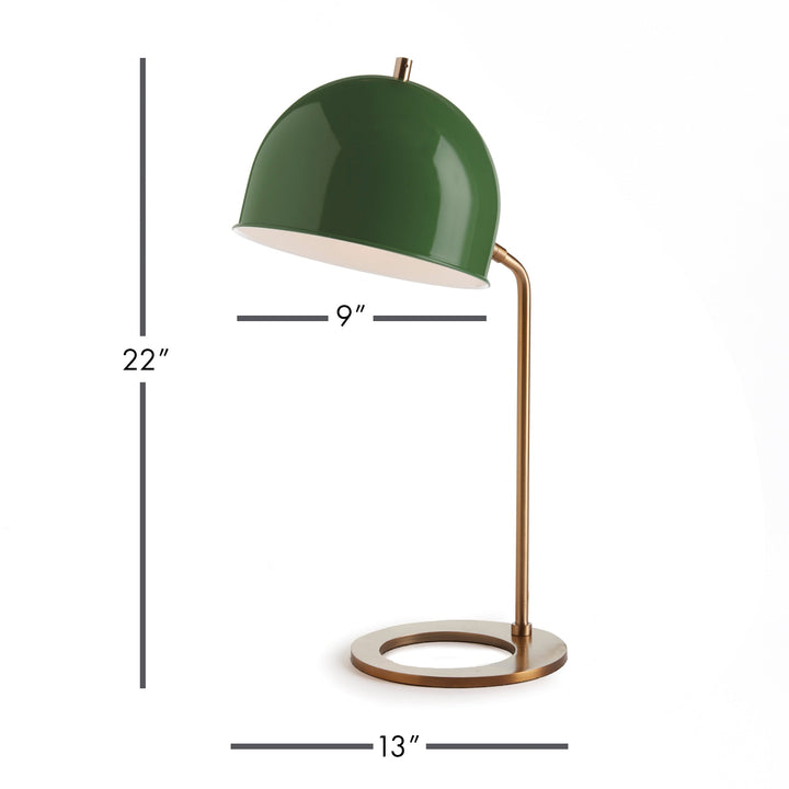 Constructed with a striking combination of a luxurious emerald green metal lamp shade and a sleek, contemporary base, this desk lamp is sure to make a statement in any home or office