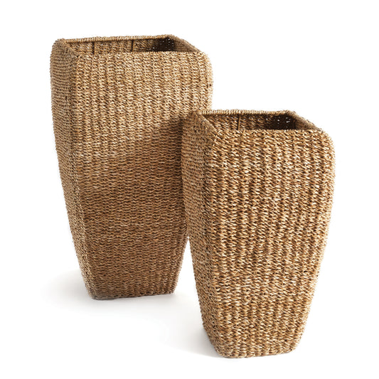 This set of tall seagrass planters are tightly woven around a wire metal frame. This warm, natural look in an over-scaled planter is a fresh look for your tall green houseplants.