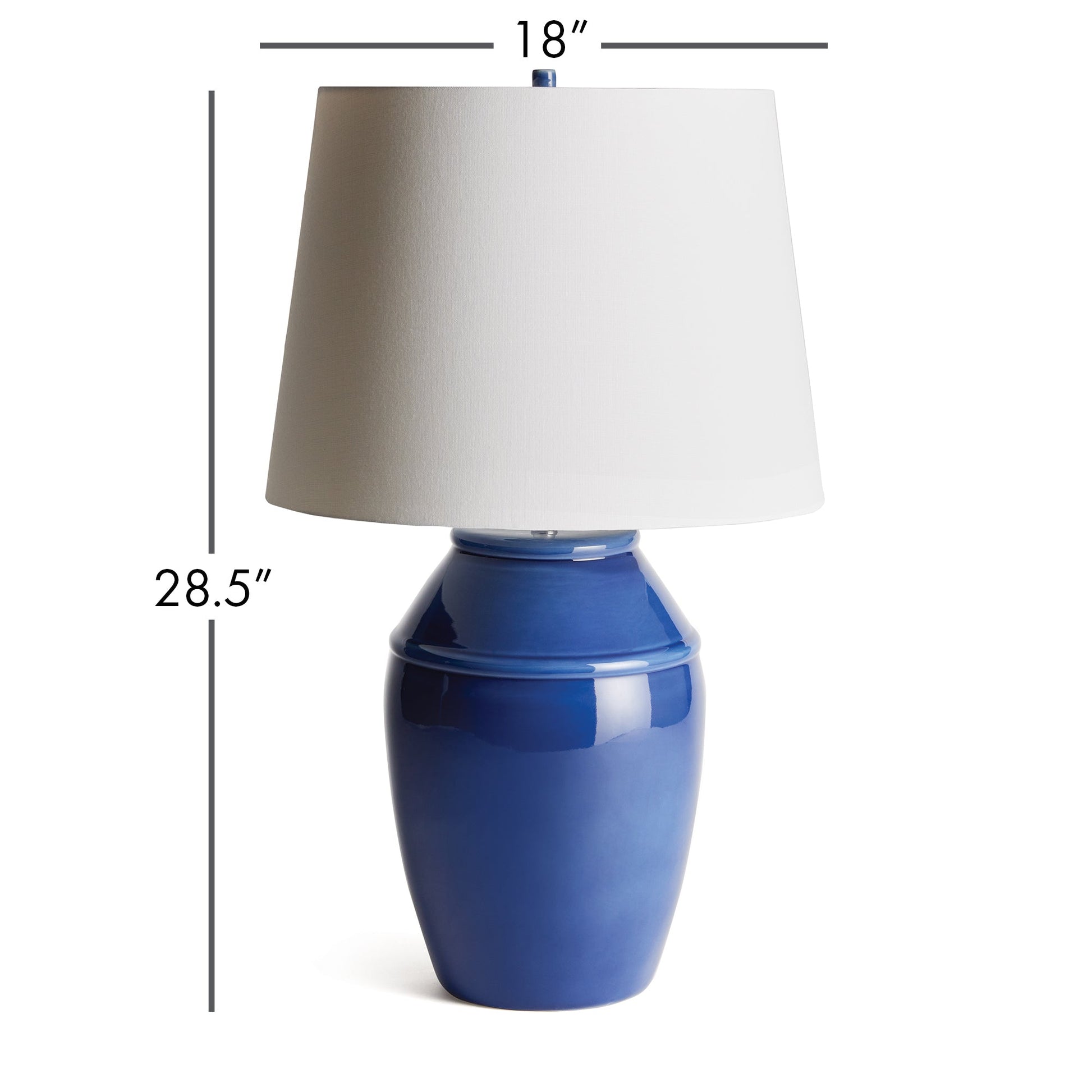 Constructed with a ceramic body and adorned with a deep, luxurious glaze, this coastal-inspired lamp exudes elegance. Enhancing its design, the wide drum shade is crafted from soft white linen, providing a striking contrast. Whether placed on a bedside table, console, or study desk, this lamp is a stunning and practical addition to any space. Its timeless blue and white color combination adds a touch of classic beauty.