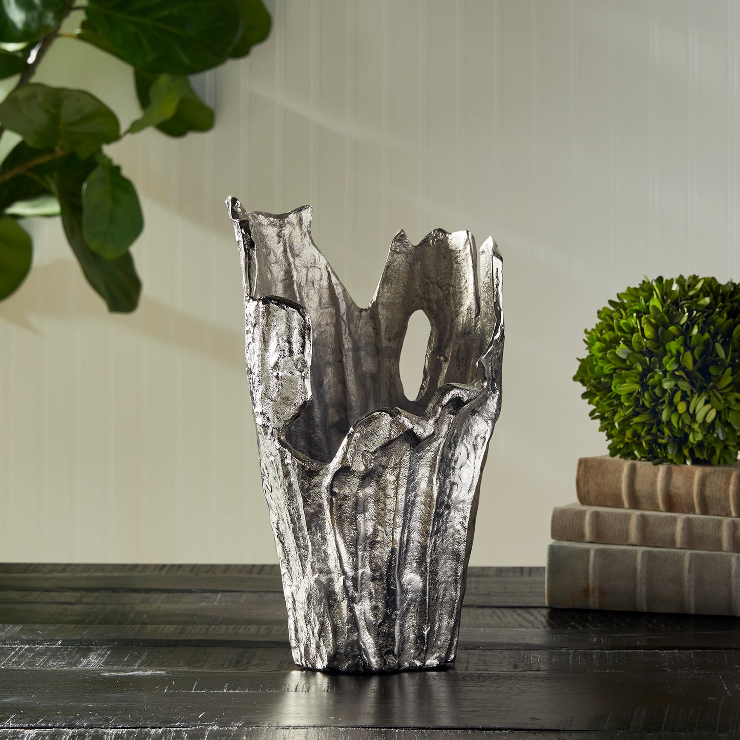 Made of a substantial cast aluminum, our Arbre Vase is an organic, sculptural piece. Add an orchid or display as is. Either way, a true original. Crafted from high-quality cast aluminum, the Arbre Silver Vase Small is an incredible example of nature-inspired art. Its beautifully organic design makes it the perfect display for your favorite orchids or as a standalone piece in any room. Experience the timeless elegance of this exquisite vase and add a touch of originality to your décor.