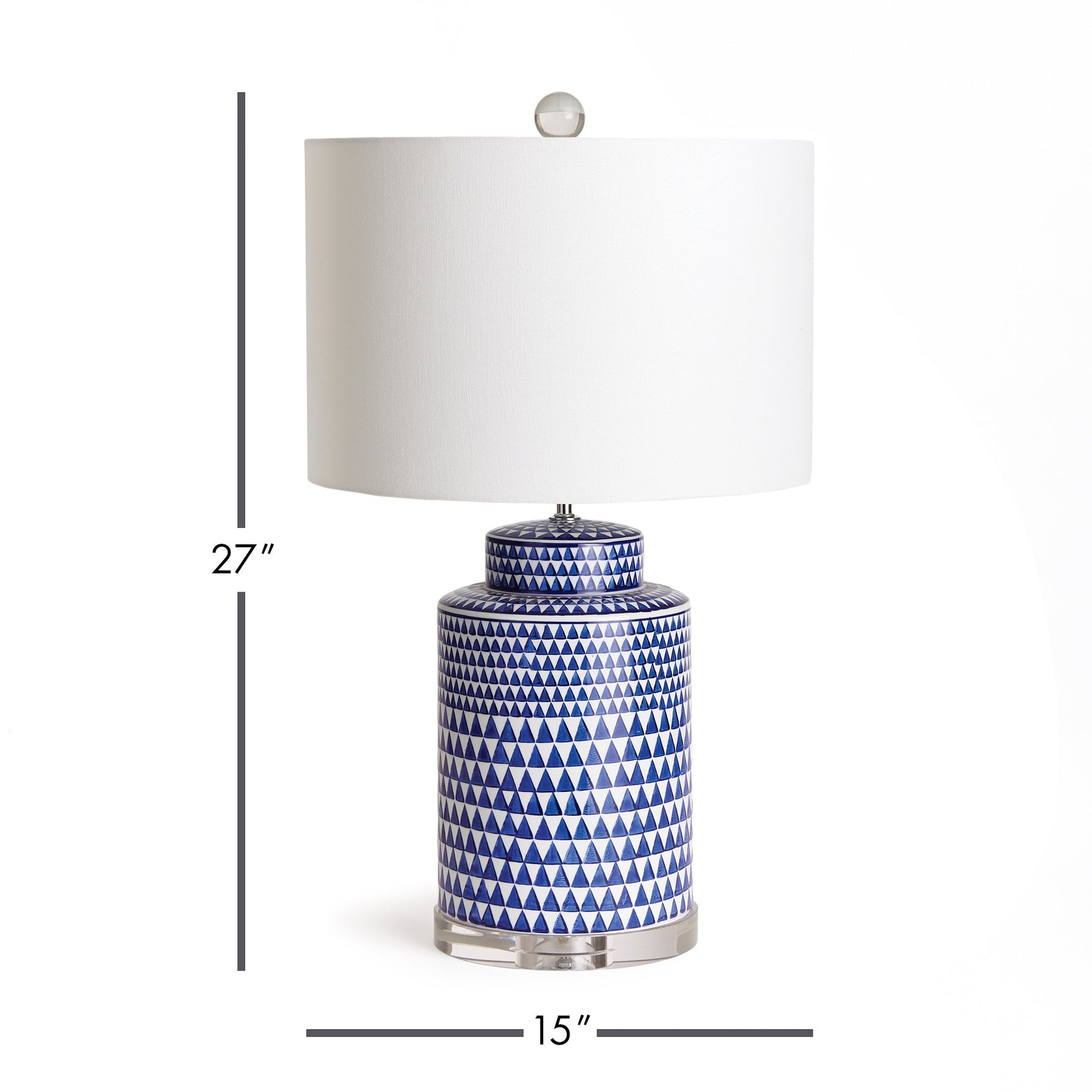 This table lamp features a traditional design in a classic blue and white ceramic ginger jar shape. Its elegant appearance adds a touch of blue to any traditional space. It also includes a crystal finial, weighs 16.5 lbs, and comes with a round shade.