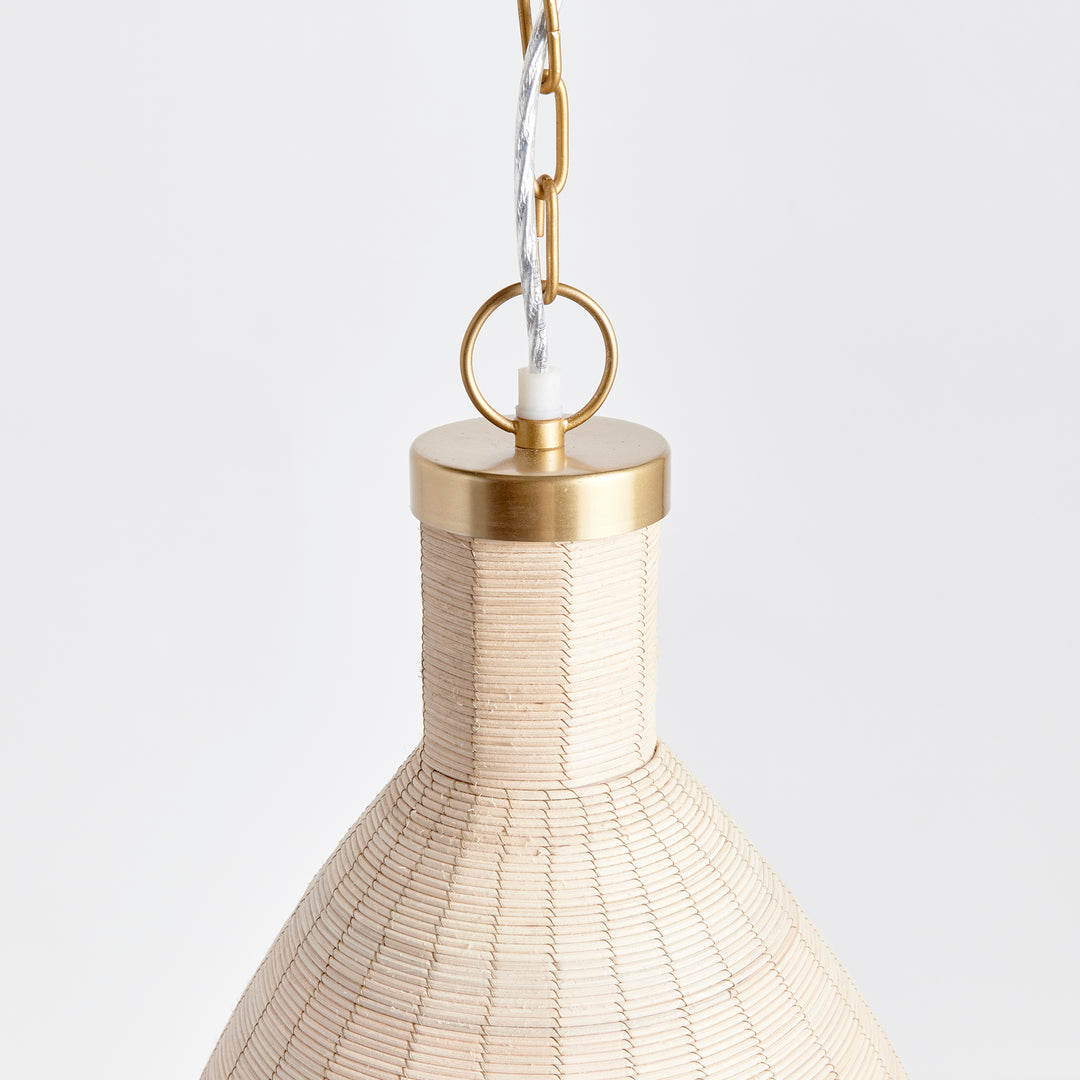 Experience the timeless style of the Maye Petite Bell Pendant Light in white, featuring a natural cane rattan weave with unique variations in color. The brass details on the top and bottom rim add a refined touch to this classic piece. Whether hung in a kitchen, entryway, or hallway, this pendant light will elevate any space with its sophisticated charm.