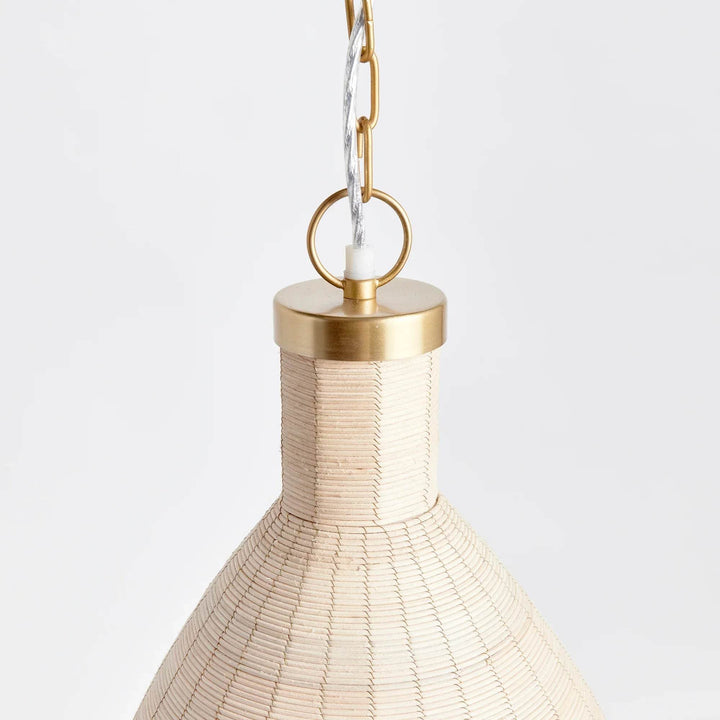Experience the timeless style of the Maye Petite Bell Pendant Light in white, featuring a natural cane rattan weave with unique variations in color. The brass details on the top and bottom rim add a refined touch to this classic piece. Whether hung in a kitchen, entryway, or hallway, this pendant light will elevate any space with its sophisticated charm.