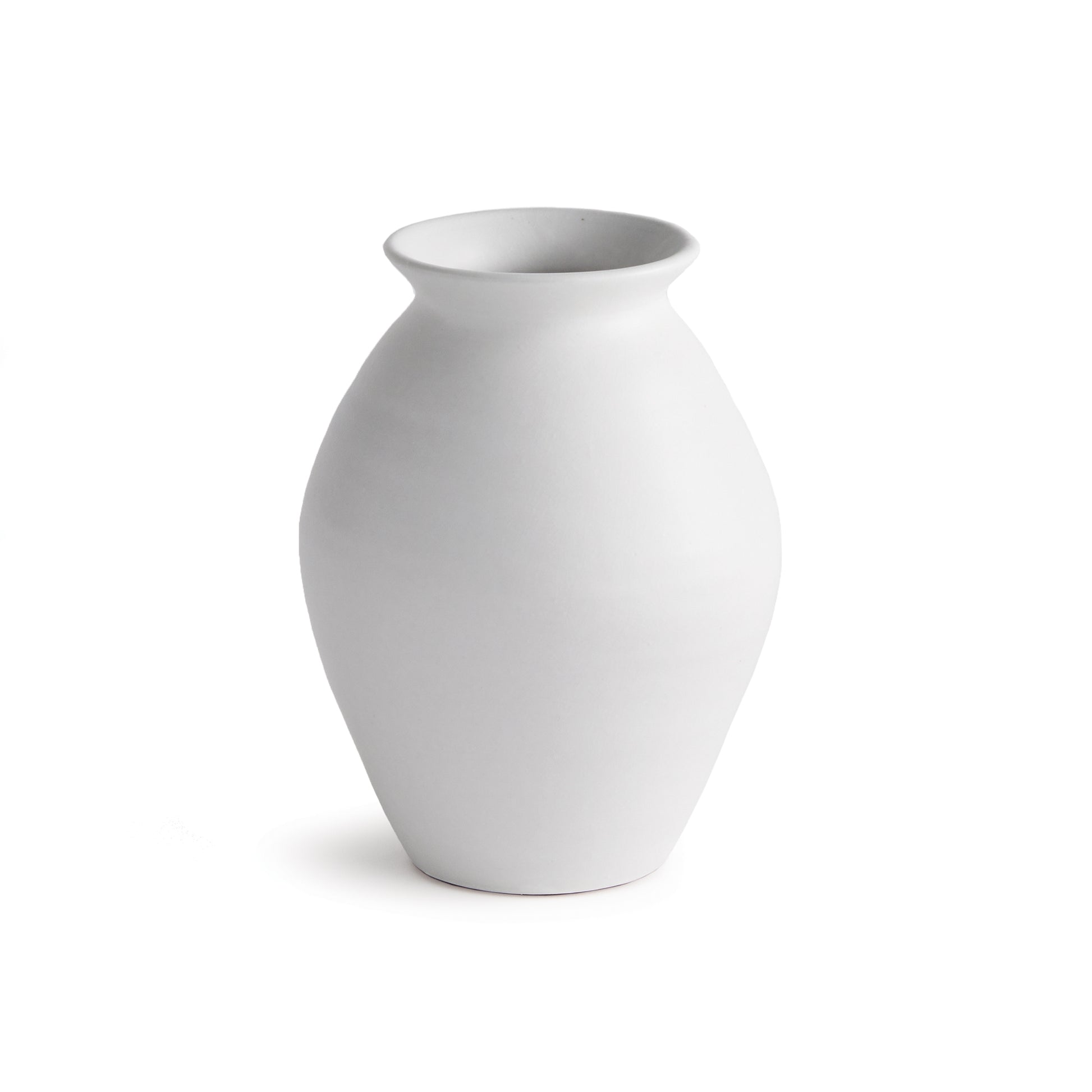 Hand thrown and perfectly imperfect, this terracotta vase brings the character. With subtle horizontal ribbing that shows through the white uneven matte glaze, It makes a lovely accent tucked in a bookshelf, or featured on a mantle or console.