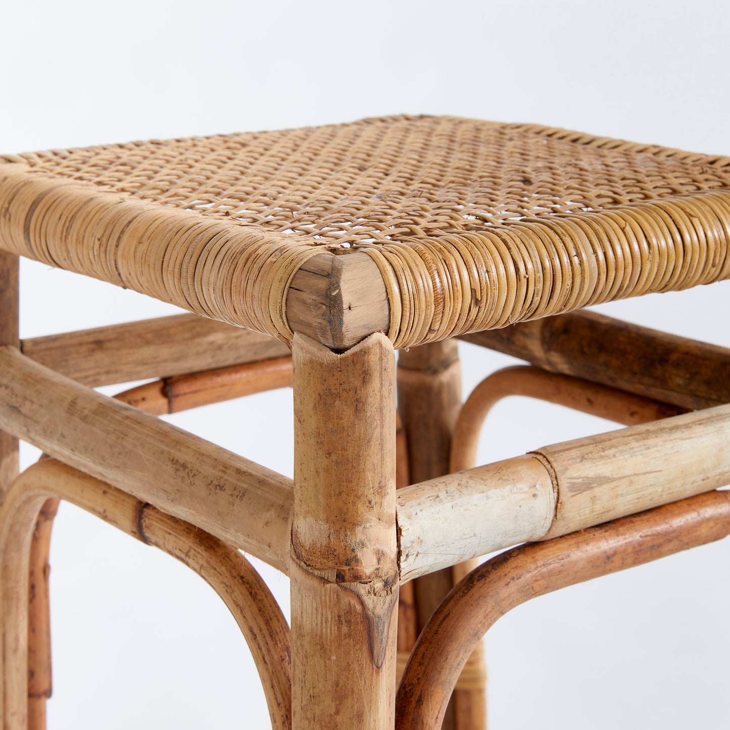 Featuring a robust wooden structure and intricate caning, the Anton Rattan Side Table is a stylish and versatile addition to any room. Use it as a chic accent piece next to your sofa or in any desired location. The table is expertly crafted from solid wood and boasts beautifully woven caning details for an elegant and sophisticated touch.