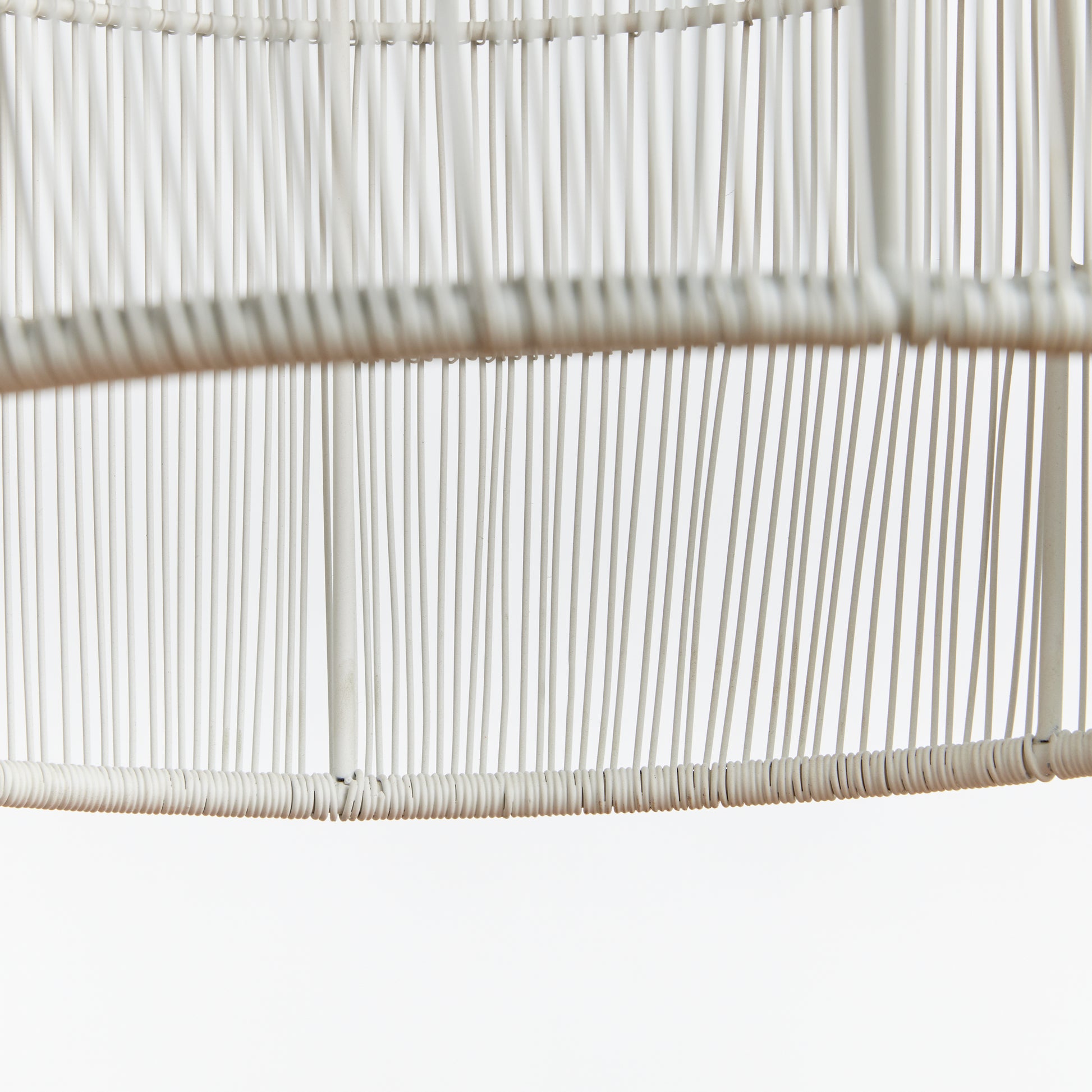 Constructed with precision, Lucia White Pendant Light features tightly-woven strands of delicate white matte metal, enveloping a sturdy iron frame on a grand scale. Its intricate design allows for the symphony of light to radiate through its open spaces, making it an ideal choice for a kitchen island or foyer decor.