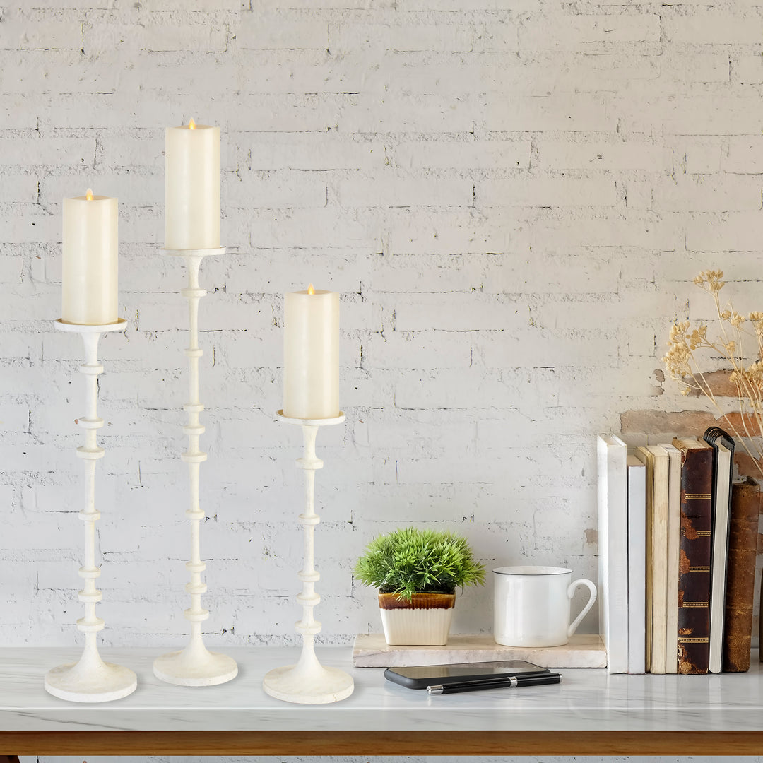 These large, oversized candle stands are perfect for a mantel or entryway. Combining modern design and traditional counting methods, the notches along the base add an interesting touch to these expertly crafted and versatile candle stands. A necessary addition to elevate your home decor, these candle stands provide a nod to the old abacus way of counting.