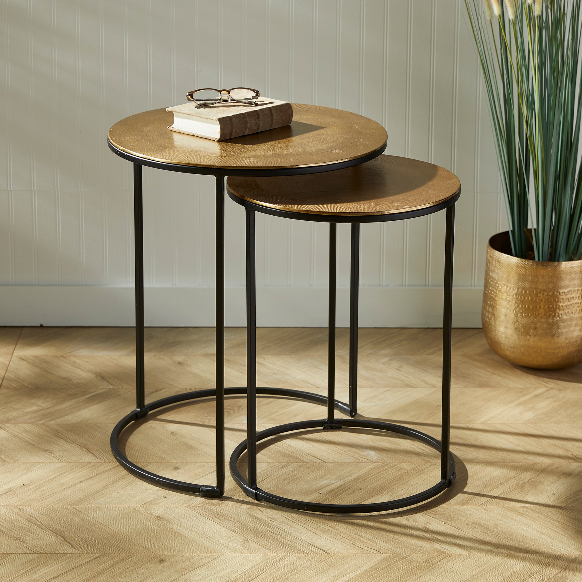 Expertly designed with durable cast aluminum construction and intricate patterns, the Alamar Gold &amp; Bronze Side Tables make a stunning addition to any living space. Featuring an elegant outer band of rich bronze, these nesting tables are perfect for placement near a sofa or in a small foyer for both aesthetic and functional purposes.