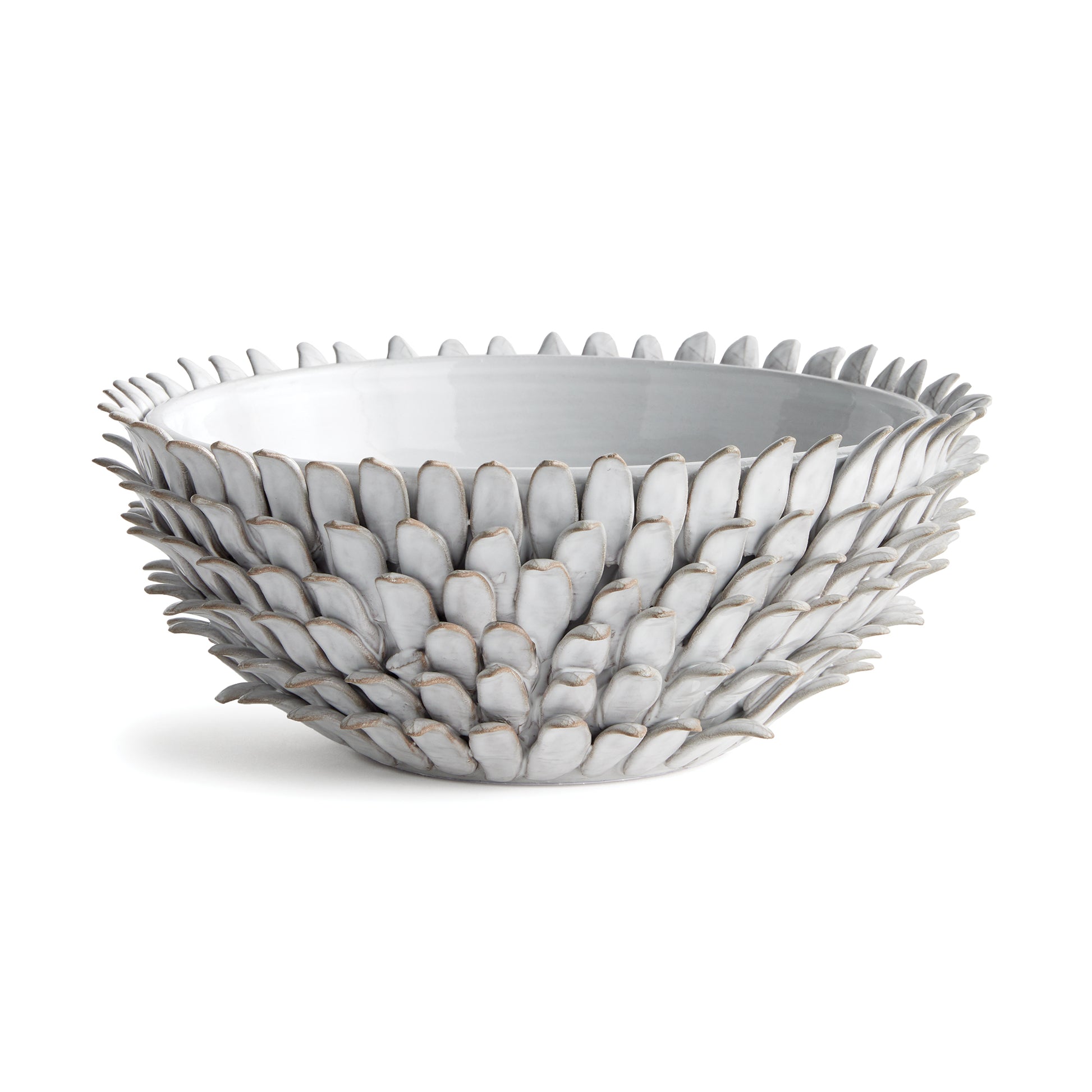 This Protea plant inspired bowl is made by the hands of a skilled artisan. Each petal painstakingly applied, then glazed and fired. A true work of art for kitchen, living room or entryway.