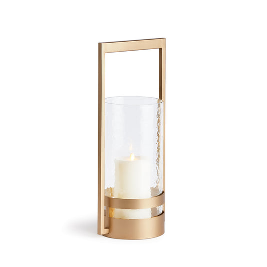 The Atrio Gold Hurricane Small is expertly crafted with a balanced blend of metal and glass, making it a standout piece. Its warm gold finish adds an elegant touch to its sleek design, making it the perfect addition to any modern, open space. The impressively sized hurricane guarantees to make a statement in any interior.