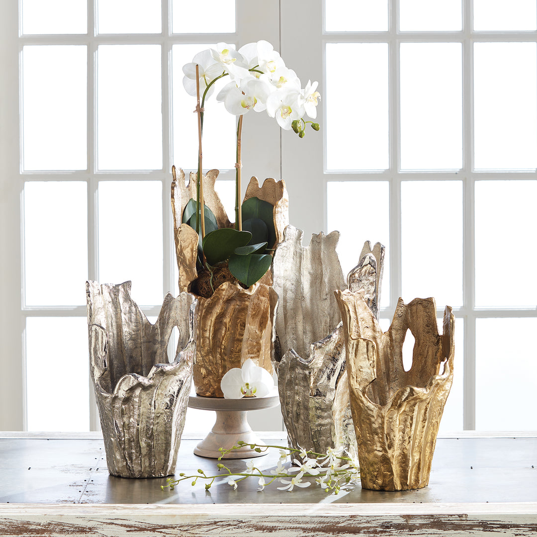 Expertly crafted with durable cast aluminum, our Arbre Vase is a stunning, organic sculpture. It can be adorned with an orchid or left as is to make a lasting statement. This vase is a truly original piece that adds artistic flair to any space. Made with cast aluminum, the Arbre Vase is a strong and long-lasting addition to your decor. Whether you choose to use it as a base for an orchid or leave it as is, this unique piece will add both beauty and functionality to your space.