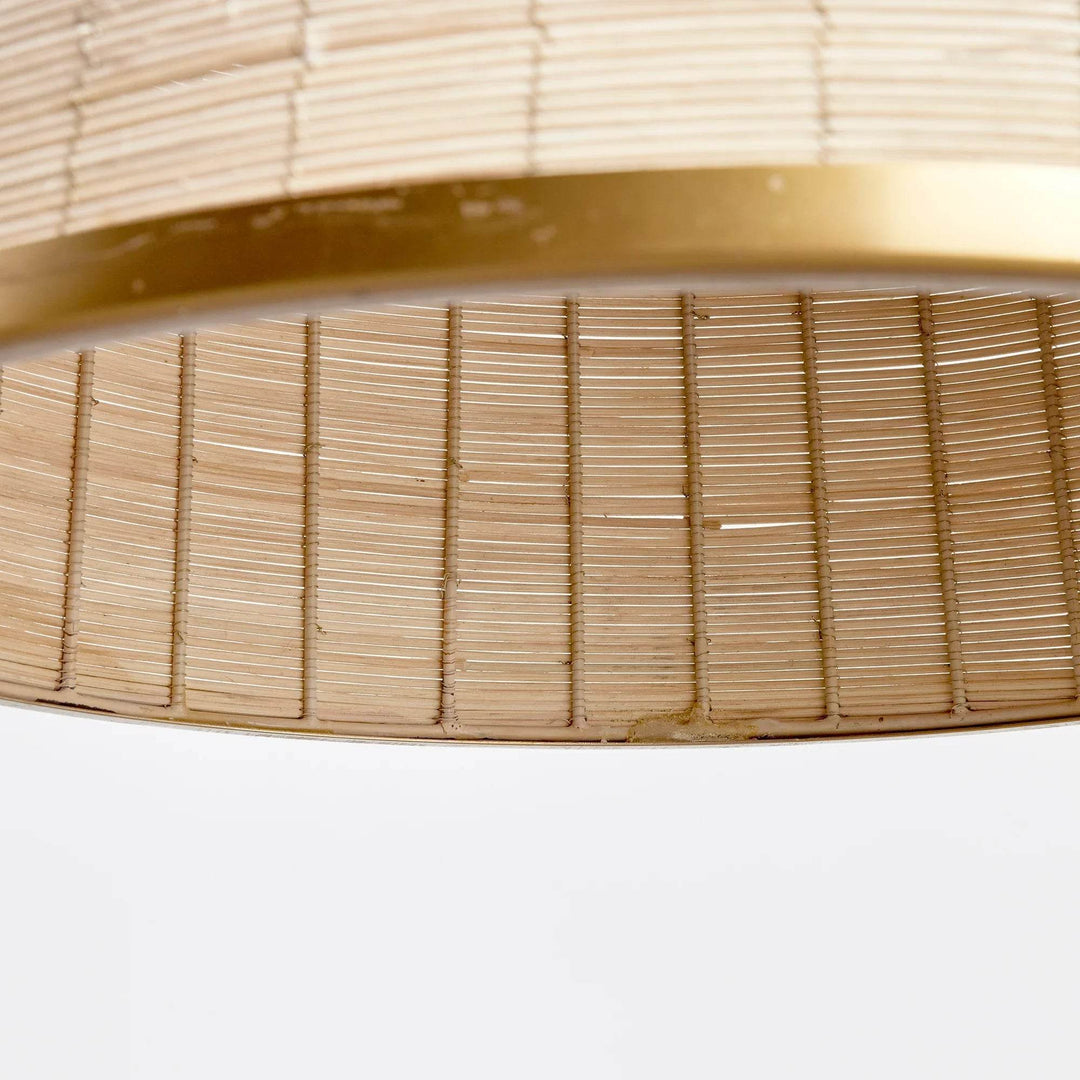 Woven in a natural cane rattan, with subtle variations in color making each one truly unique, this pendant is an instant classic. The brass details on the top and along the bottom rim make it decidedly more refined. And talk about scale! A show-stopping choice for kitchen island, entry foyer or hallway.