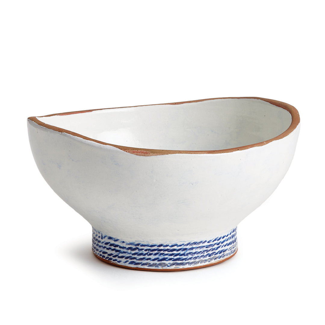 Our Coastal Themed Decorative Bowl features a Grecian blue striped design and exposed clay rim, evoking the beauty of the Mediterranean. The fully glazed interior adds a touch of luxury and elegance, making it a perfect addition to any coastal-themed decor. Whether used as a stunning centerpiece or to display fresh limes, this versatile bowl is sure to impress.