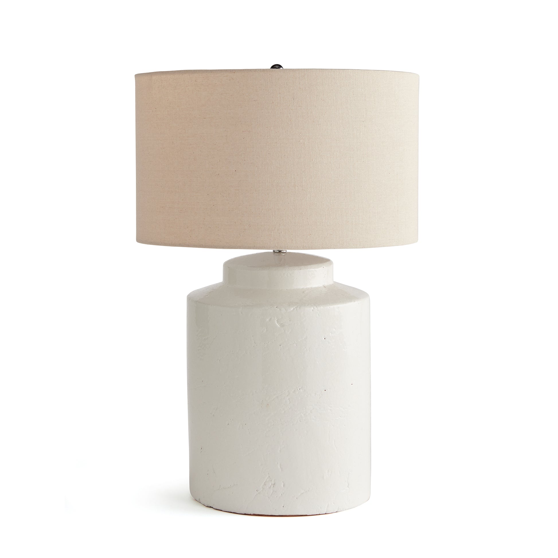 In a classic white ceramic with a thickly-applied glaze, this lamp is made for the transitional setting. A generously scaled white linen shade & simple finial finish off the look