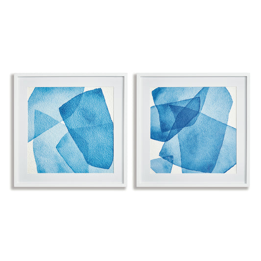 Utilize the stunning layers of abstract blue hues and simple white frame to capture the tranquil essence of the ocean and sky in our Abstract Watercolor Wall Prints Set. This pair of prints perfectly complements the modern coastal atmosphere, adding a touch of sophistication to any space. Choose to elevate your home with our expertly crafted prints.