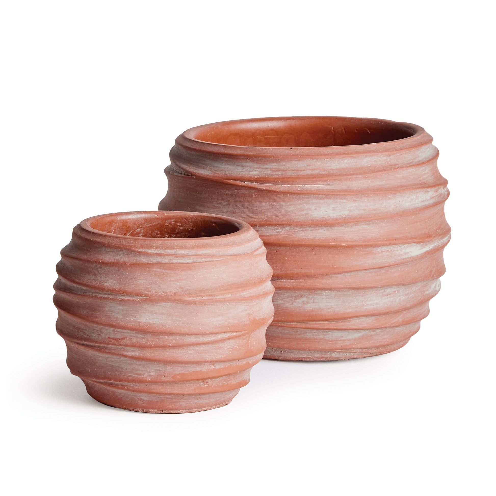 A graphic pattern of concentric circles make this set of pots very mod indeed. The raw, earth washed finish adds a touch of natural warmth. Add your favorite blooms or lush greens and enhance any contemporary space.