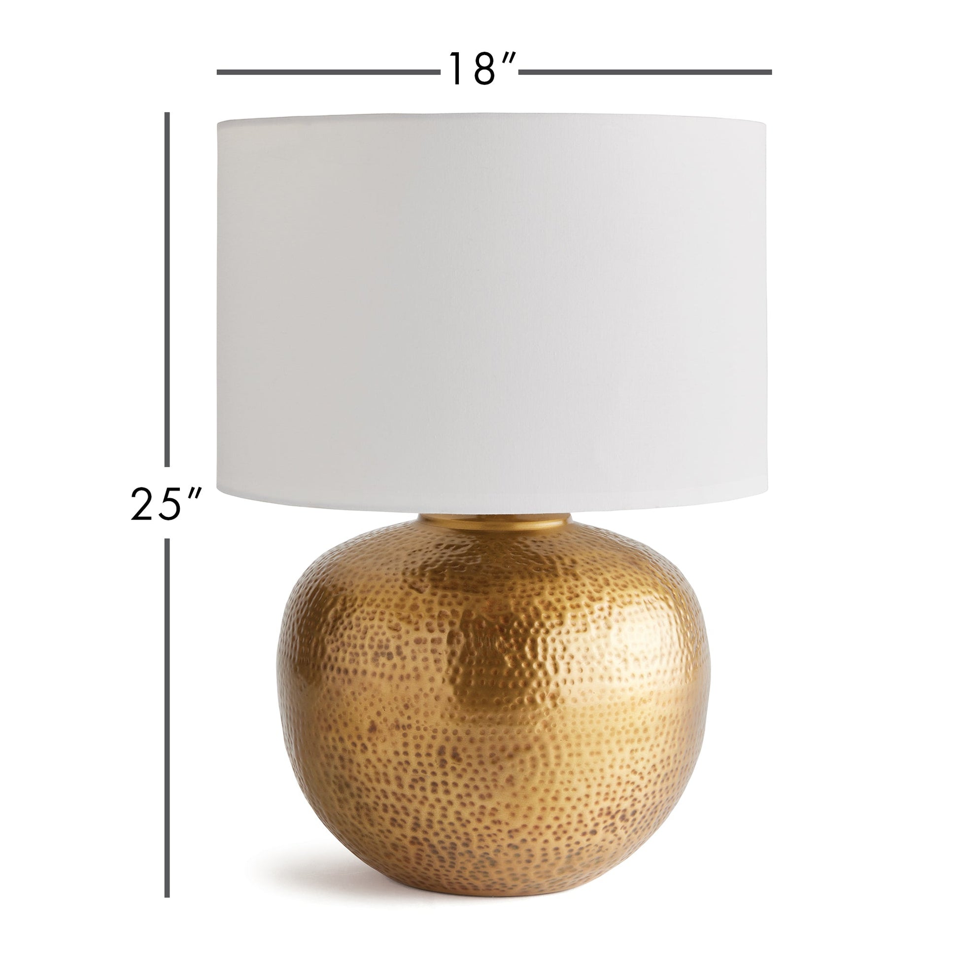 Crafted with a round base in warm brass and an impressive scale, the Tara Gold &amp; White Table Lamp serves as a handsome anchor for any room. Its clean white linen drum shade adds a soft touch and complements the bold design. Made from hammered iron, this one-of-a-kind lamp is sure to catch the eye and become a stunning focal point in your space. Dimensions