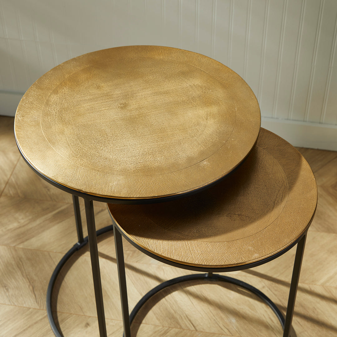 Expertly designed with durable cast aluminum construction and intricate patterns, the Alamar Gold &amp; Bronze Side Tables make a stunning addition to any living space. Featuring an elegant outer band of rich bronze, these nesting tables are perfect for placement near a sofa or in a small foyer for both aesthetic and functional purposes.