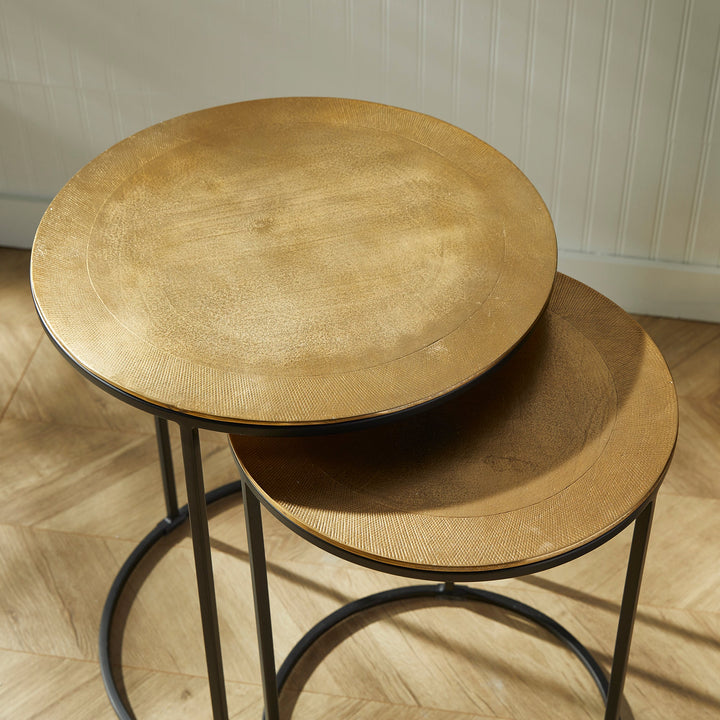 Expertly designed with durable cast aluminum construction and intricate patterns, the Alamar Gold &amp; Bronze Side Tables make a stunning addition to any living space. Featuring an elegant outer band of rich bronze, these nesting tables are perfect for placement near a sofa or in a small foyer for both aesthetic and functional purposes.