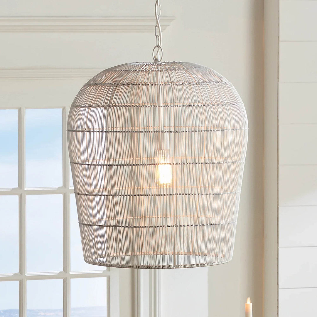 This pendant light features a solid iron frame that is elegantly wrapped in delicate white matte metal strands. With an open design, it brings a beautiful symphony of light, making it a great choice for placement in kitchens or foyer areas. Expertly crafted, it creates an elegant and grand aesthetic with its combination of materials.