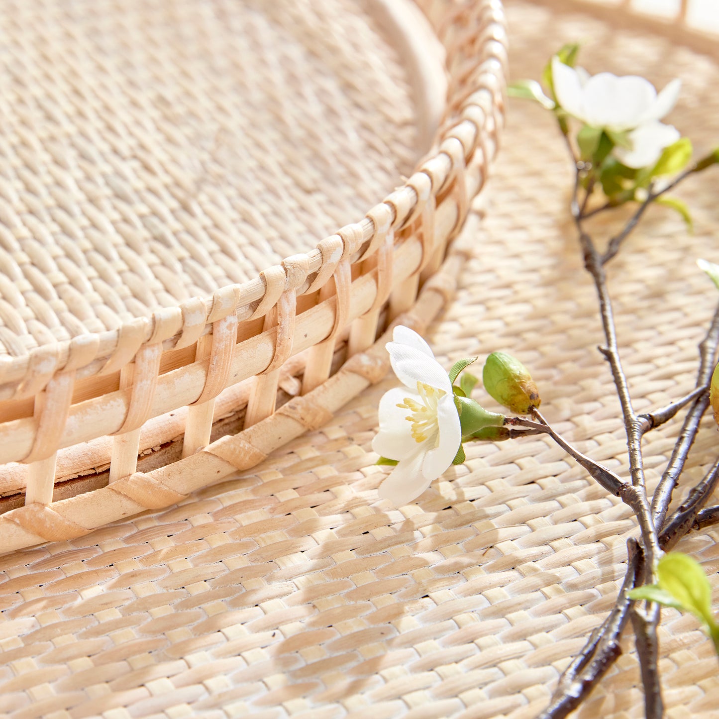 Crafted from woven rattan and coated with a fresh whitewash finish, these coastal-inspired trays add a touch of charm to any space. Use them on your coffee table or ottoman as a stylish base for creating beautiful vignettes. Enhance your home decor with Barri Coastal Decorative Trays Set of 2.