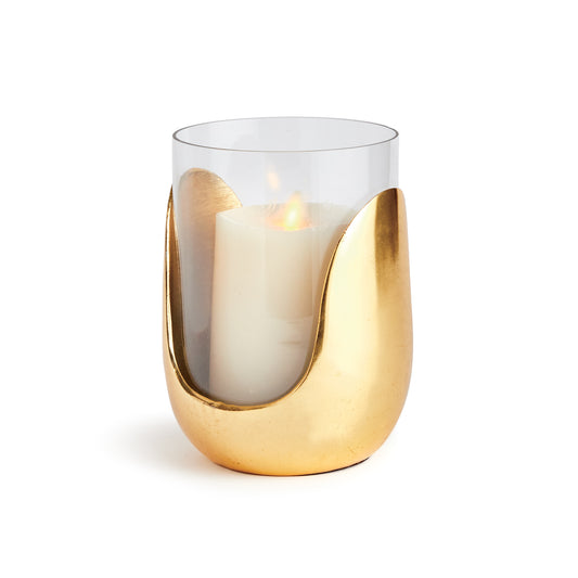 In a marriage of thoughtful design and mixed materials, this stunning hurricane features hand blown glass that slides into a cast aluminum abstract Base in a warm champagne. A truly unique contemporary accent for side table, console or mantel.