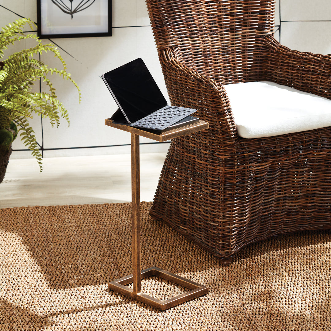 Expertly designed for modern living, this antique gold and black accent table exudes elegance with its petite surface and ornate frame. Effortlessly move it around your space to stylishly hold any beverage, dessert plate, or even a laptop. Its compact size adds versatility and convenience to any room.