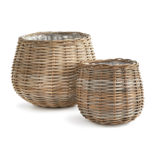 Beautifully woven rattan baskets, largescale and lined with a thick plastic, how smart! The perfect vessels for your favorite tree or large leafy plants.