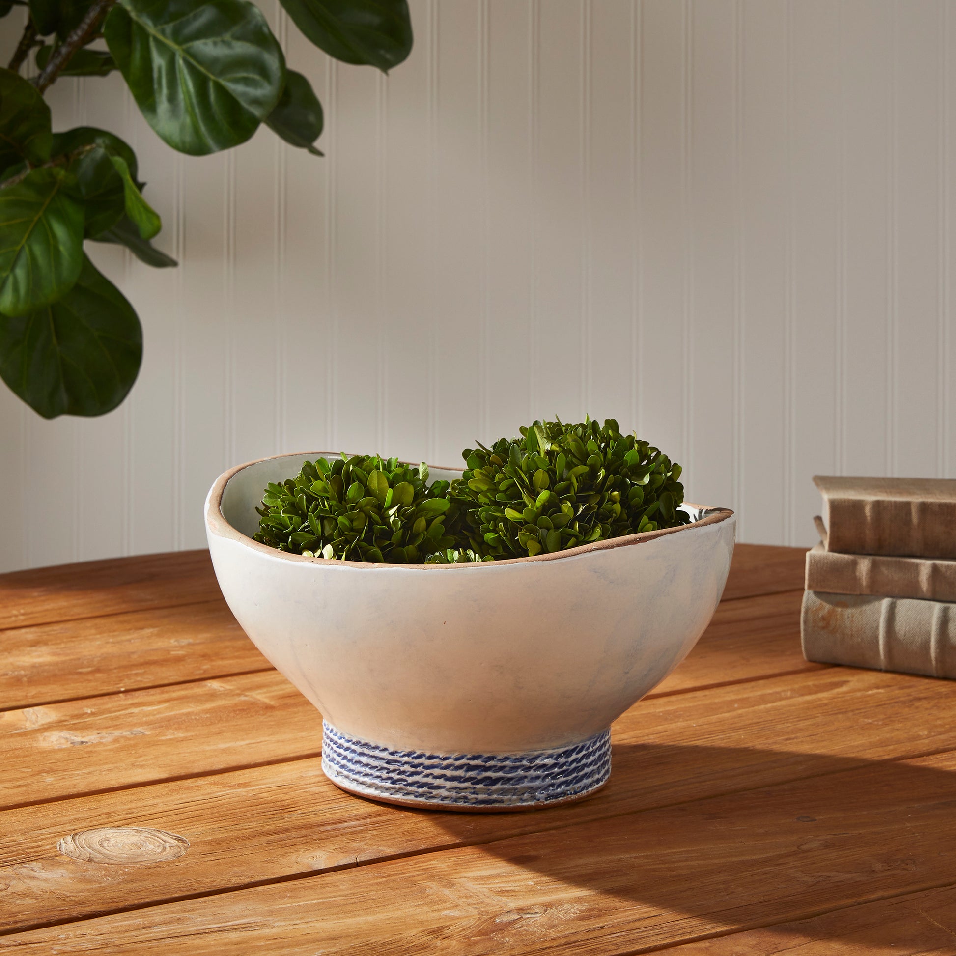 Our Coastal Themed Decorative Bowl features a Grecian blue striped design and exposed clay rim, evoking the beauty of the Mediterranean. The fully glazed interior adds a touch of luxury and elegance, making it a perfect addition to any coastal-themed decor. Whether used as a stunning centerpiece or to display fresh limes, this versatile bowl is sure to impress.