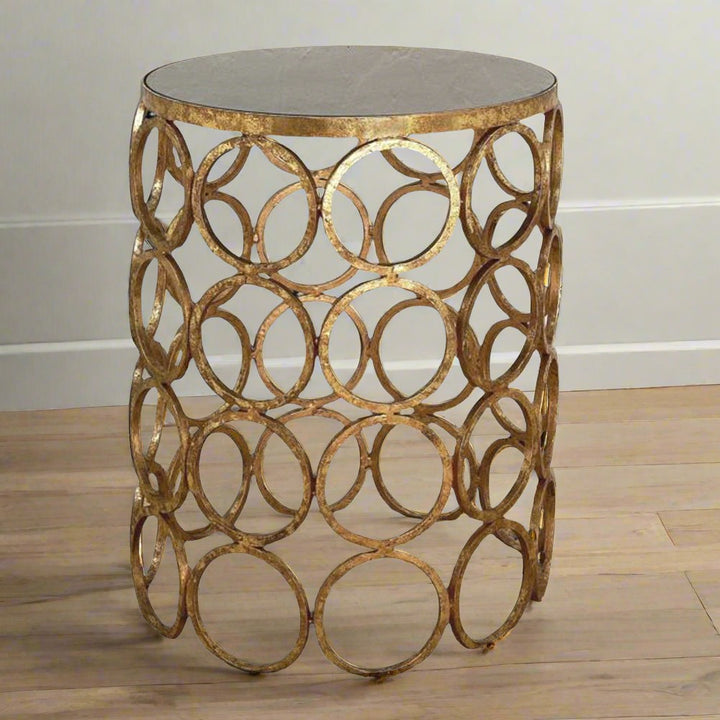 This exquisite side table is an essential addition to any living room. Its Italian gold iron finish and circular design lend an air of sophistication to any room. Meticulously crafted with premium materials such as high-grade iron and a stunning granite top, it not only enhances the aesthetic appeal of your space but also offers lasting durability and practicality. Be the envy of your guests with this captivating conversation starter.