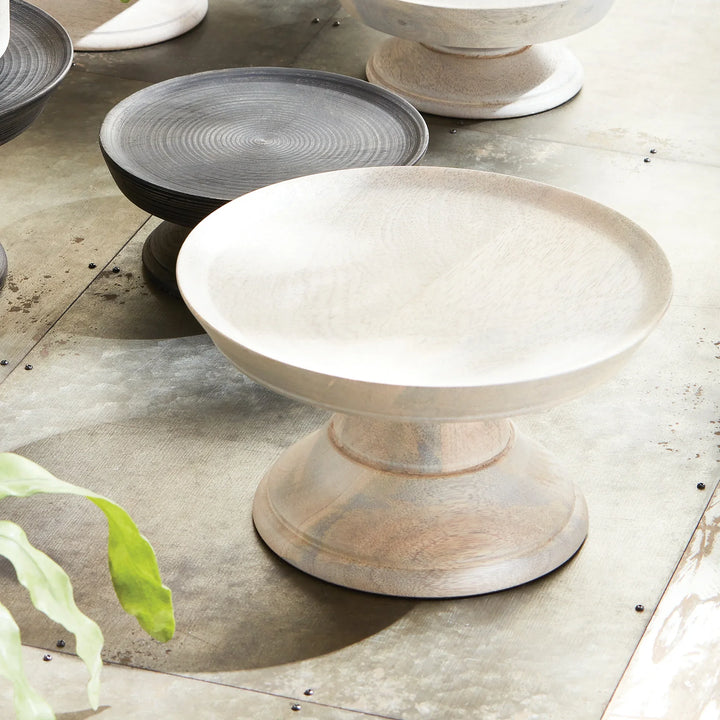 Set of ceramic bowls on a textured surface