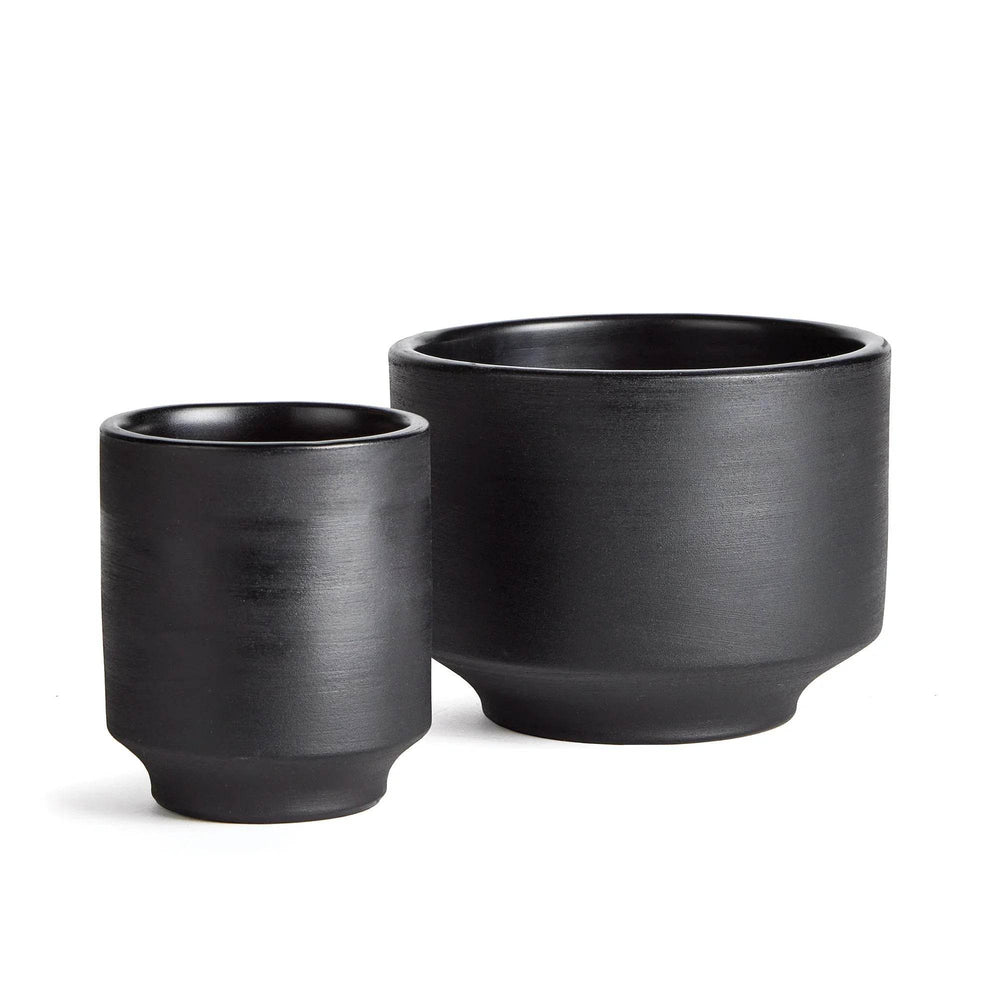 Two black ceramic planters on a white background